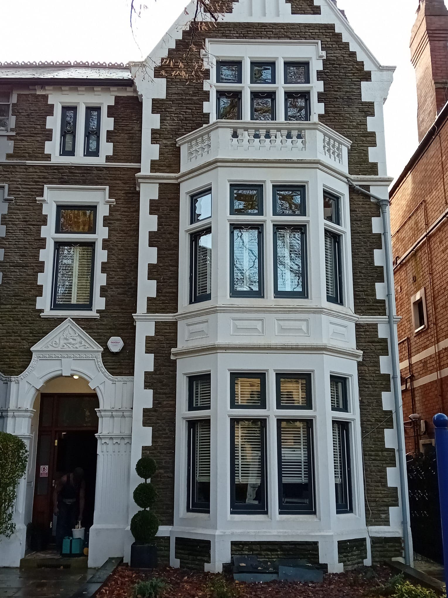 Complete Victorian house window restoration featuring white painted timber sash windows