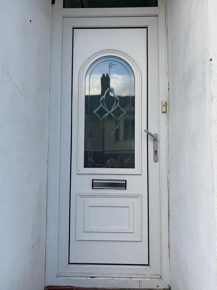 Victorian door before restoration - weathered white paint