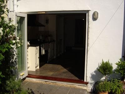 Bifolding doors fully opened to garden