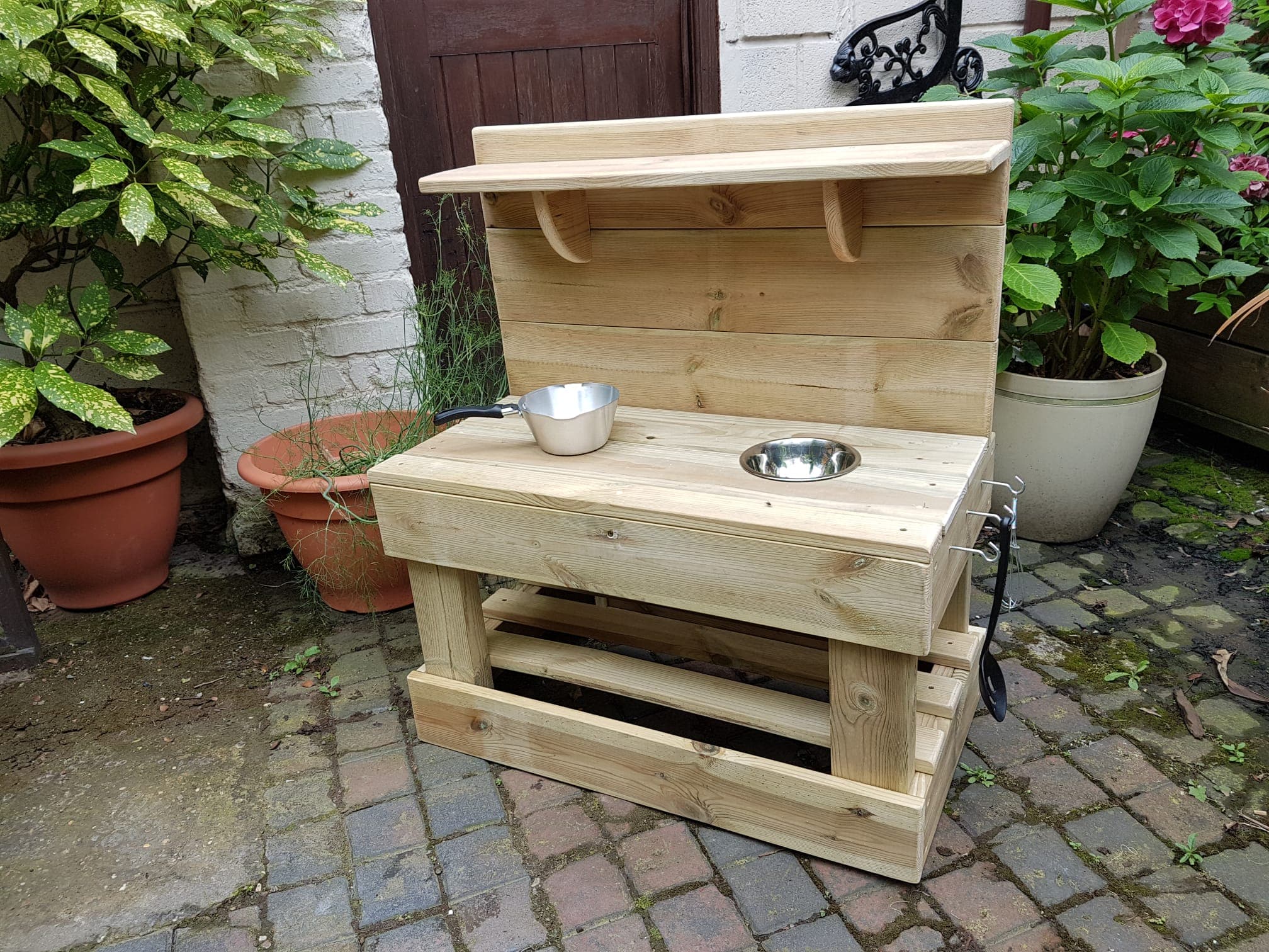 Custom garden pet feeding station with multi-level design