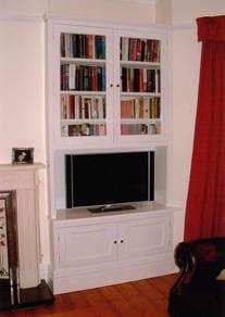 TV unit in alcove with storage