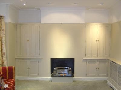 Matching alcove units either side of fireplace