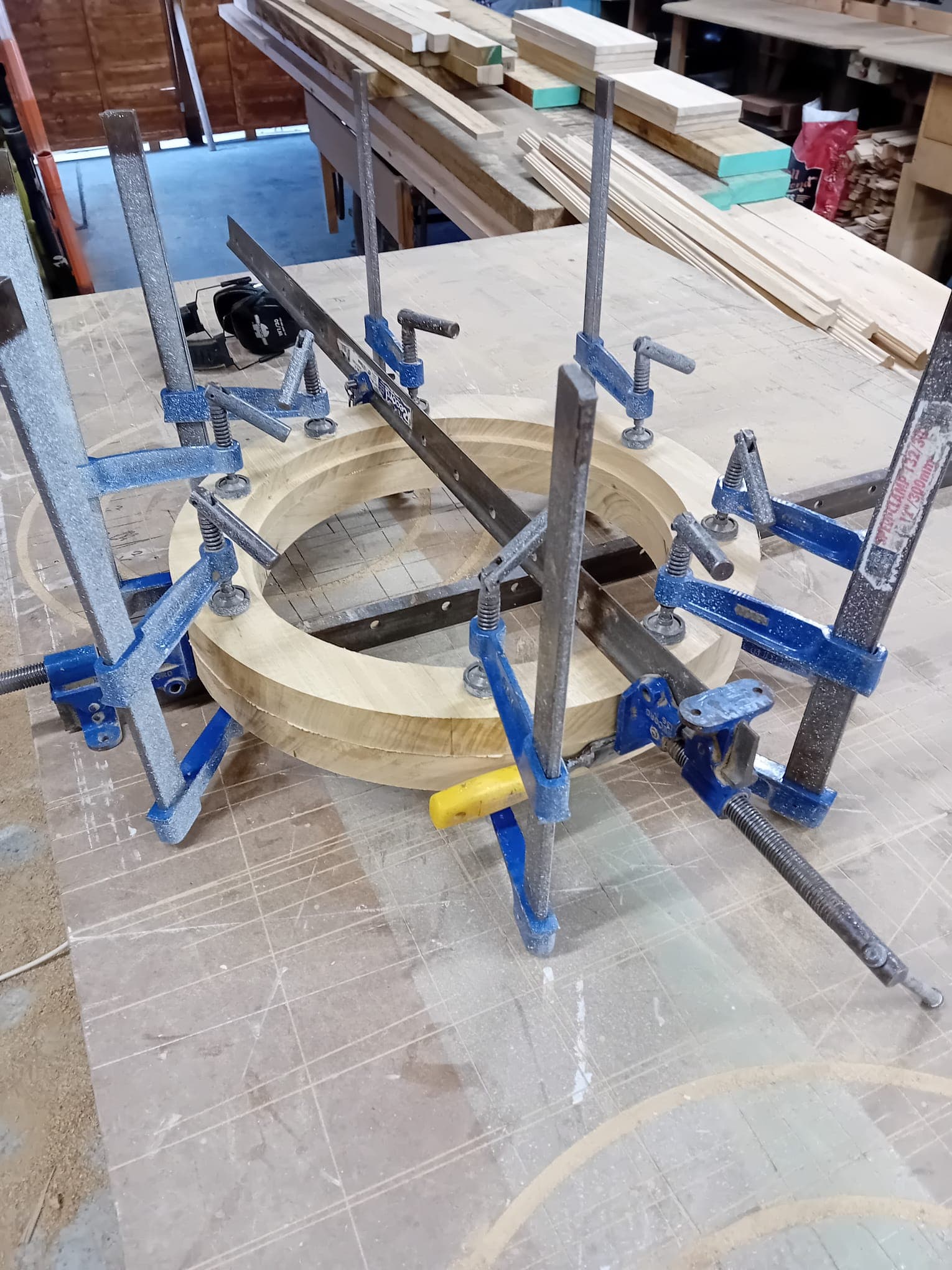 Circular window frame being assembled